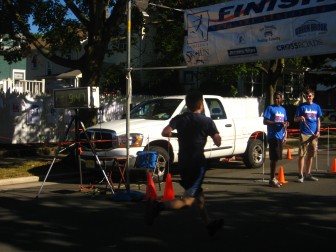 Runner reaching the finish line at Dunellen Education Foundation 2012 5K race.