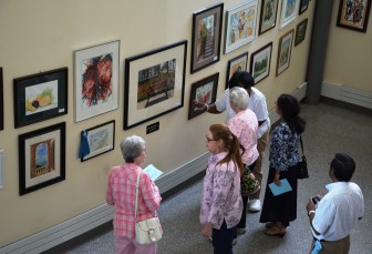 Visitors view entries to the Middlesex County's annual senior art competition in 2015.