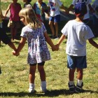 Children Holding Hands on School Playground