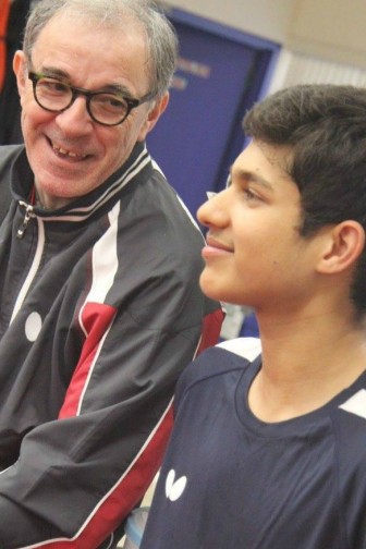 US Olympic Head Coach Massimo and player Kanak Jha enjoy a moment offsides during the Friends with Paddles fundraiser at Lily Yip Table Tennis Center in Dunellen, NJ, June 18, 2016.