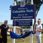 Dunellen resident Sydney McLaughlin and her brother Taylor reveal the new sign in front of Columbia Park, acknowledging her 2016 athletic accomplishments.