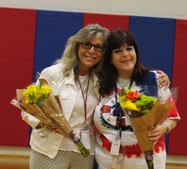 two female teachers with flowers